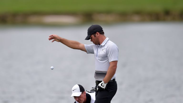 Paul Casey takes a penalty drop after finding water on his penultimate hole