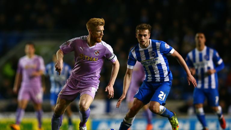 Paul McShane of Reading runs with the ball under pressure from James Wilson 