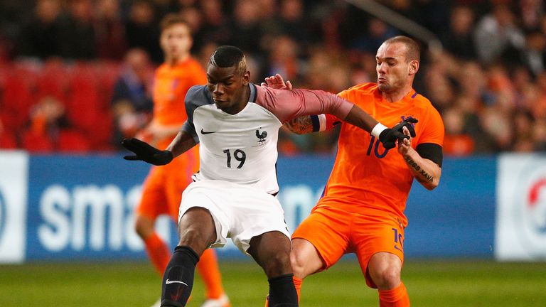 Paul Pogba of France is closed down by Wesley Sneijder on Friday night