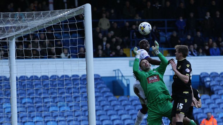 Paul Rachubka of Bolton saves the ball under pressure