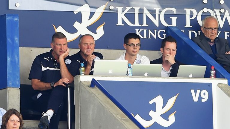 Nigel Pearson (L), manager of Leicester City watches from the stands during the Barclays Premier League match between Leice