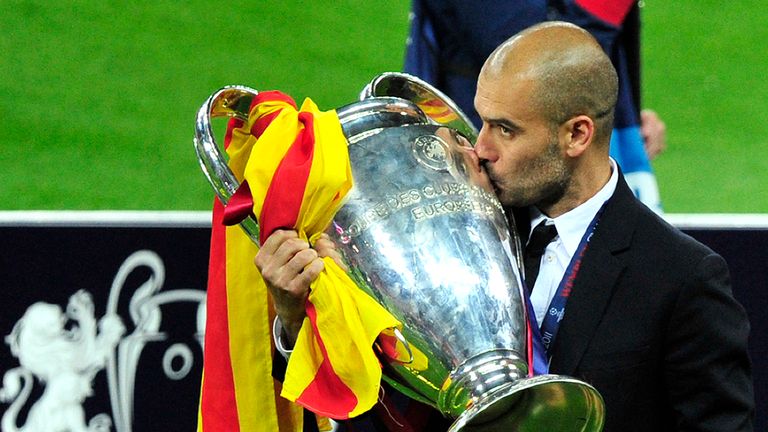 Josep Guardiola kisses the trophy at the end of the UEFA Champions League final football match FC Barcelona vs. Manchester United