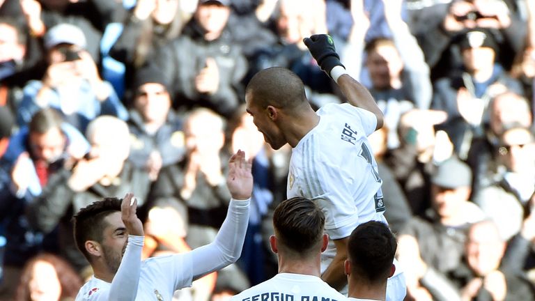 Real Madrid's Portuguese defender Pepe (top) celebrates a goal with teammates