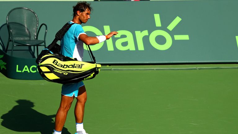 Rafael Nadal of Spain walks off court after retiring against Damir Dzumhur of Bosnia and Herzegovina in Miami