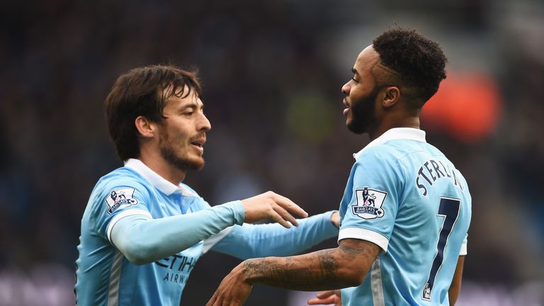 Raheem Sterling of Manchester City celebrates scoring his team's fourth goal with David Silva 