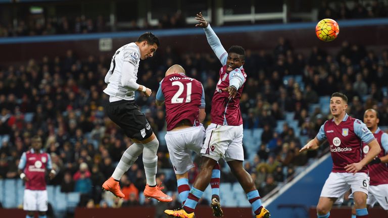 Everton's Ramiro Funes Mori (second left) heads the ball to score his team's first goal against Aston Villa