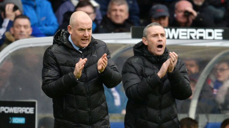 Mark Warburton (left) saw his Rangers side lose three goals for the second consecutive game