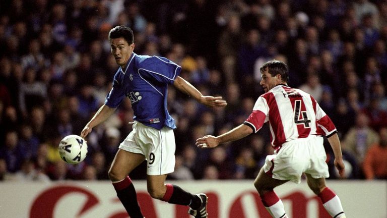 20 Oct 1999:  Michael Mols of Rangers beats Ernest Faber of PSV Eindhoven in the UEFA Champions League Group F match at Ibrox in Glasgow. Rangers won 4-1. 