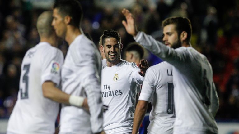 Real Madrid's midfielder Isco celebrates a goal with teammates during the Spanish league football match Levante v Real Madrid CF at the Ciutat de Valencia