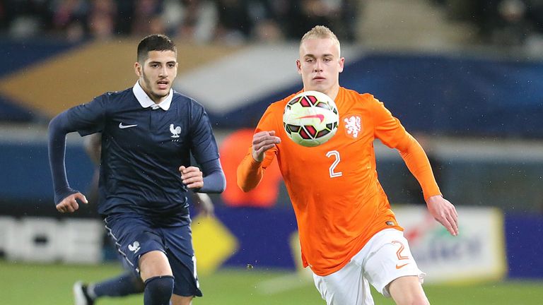 French Yassine Benzia (L) fights for the ball with Dutch Rick Karsdorp (R) 