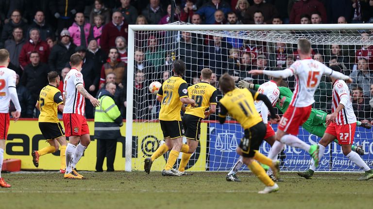 Ricky Holmes scores Northampton's third goal against Stevenage