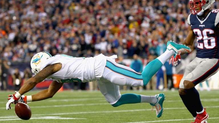 Rishard Matthews #18 of the Miami Dolphins drops a pass during the second quarter against the New England Patriots at Gillette S