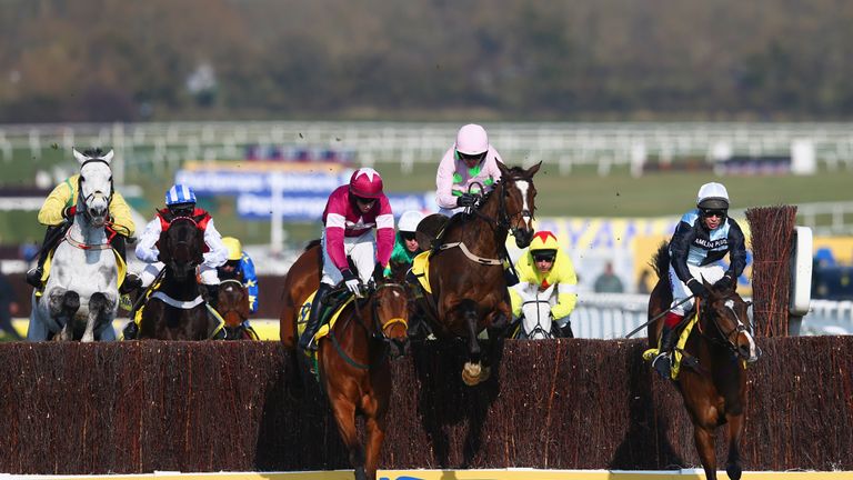 CHELTENHAM, ENGLAND - MARCH 17:  BJ Cooper on Road To Riches, eventual winner Ruby Walsh on Vautour and Richard Johnson on Village Vic clear a jump