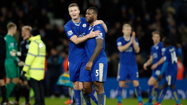 Leicester City's defender Robert Huth and Wes Morgan embrace