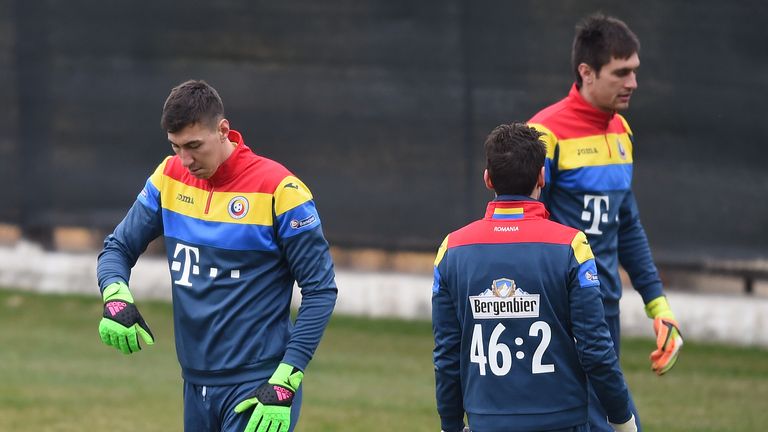 Romania's goalkeeper Costel Pantilimon (L) attends a training session o