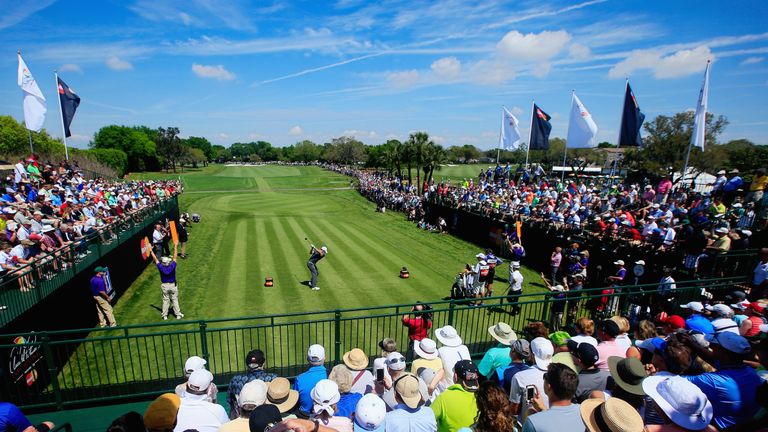 ORLANDO, FL - MARCH 21: Rory McIlroy of Northern Ireland hits his tee shot on the first hole as a grandstand of fans look on during the third round of the 