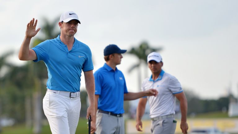 Rory McIlroy laps up the applause after rolling in his eighth birdie of the day at the closing hole