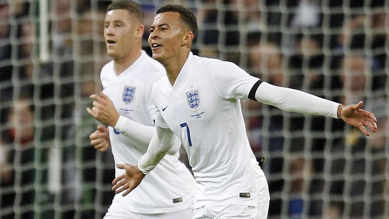 England's midfielder Dele Alli (R) celebrates scoring his team's first goal v France in their November 2015 friendly