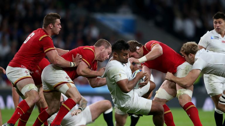 England No 8 Billy Vunipola of England is tackled by Gethin Jenkins and Alun Wyn Jones of Wales during the World Cup