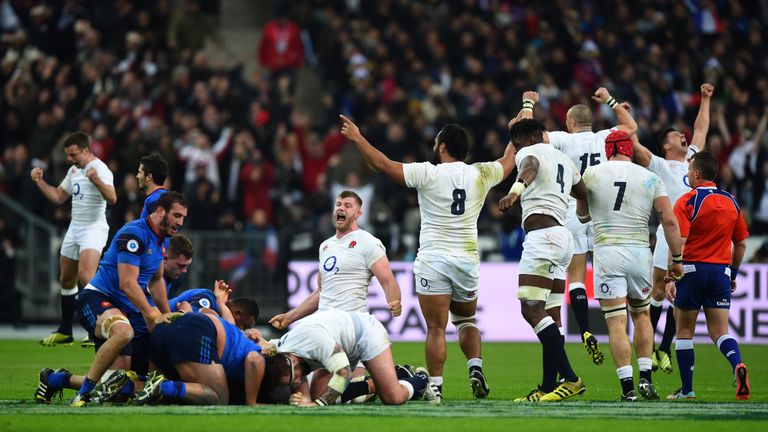 England players celebrate their Six Nations Grand Slam-clinching victory over France