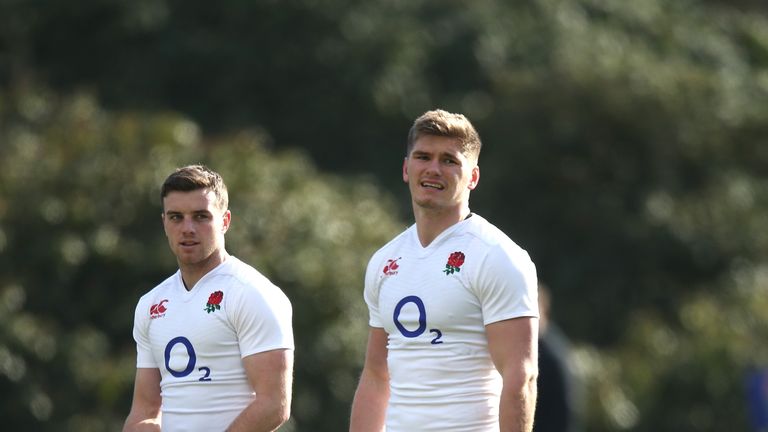 Owen Farrell looks on with team mate George Ford (L) during an England training session
