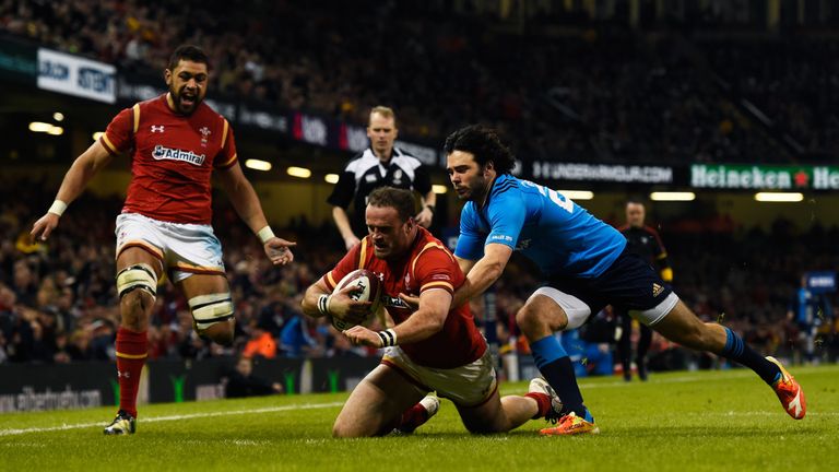 Jamie Roberts goes past Luke McLean of Italy to scores Wales' fourth try