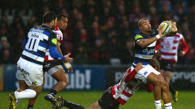 Jonathan Joseph looks to offload as Billy Twelvetrees of Gloucester holds on in the tackle 