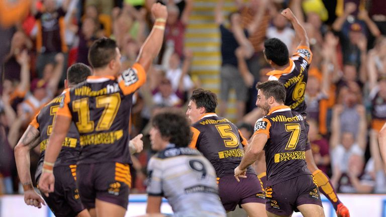 Anthony Milford leads celebrations after kicking the winning field goal against the Cowboys