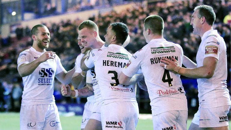 Widnes's Kevin Brown (third from left) is congratulated after scoring a try against Hull FC