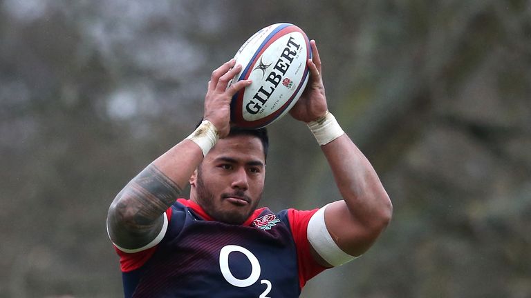 Manu Tuilagi catches the ball during an England training session