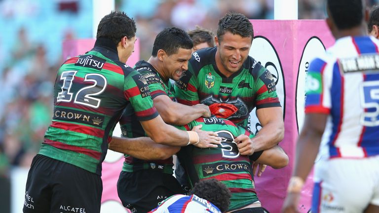 Kyle Turner, Cody Walker and Sam Burgess of the Rabbitohs congratulate Bryson Goodwin after his try against Newcastle