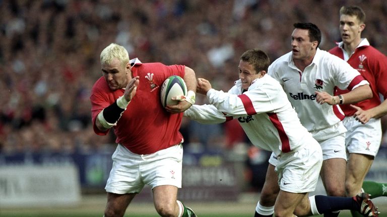 Scott Quinnell of Wales is held by Jonny Wilkinson of England in the Five Nations match at Wembley in 1999
