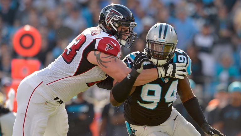 Kony Ealy #94 of the Carolina Panthers rushes the quarterback against Ryan Schraeder #73 of the Atlanta Falcons in the 1st qu