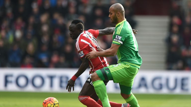 Sadio Mane controls the ball under pressure from Younes Kaboul