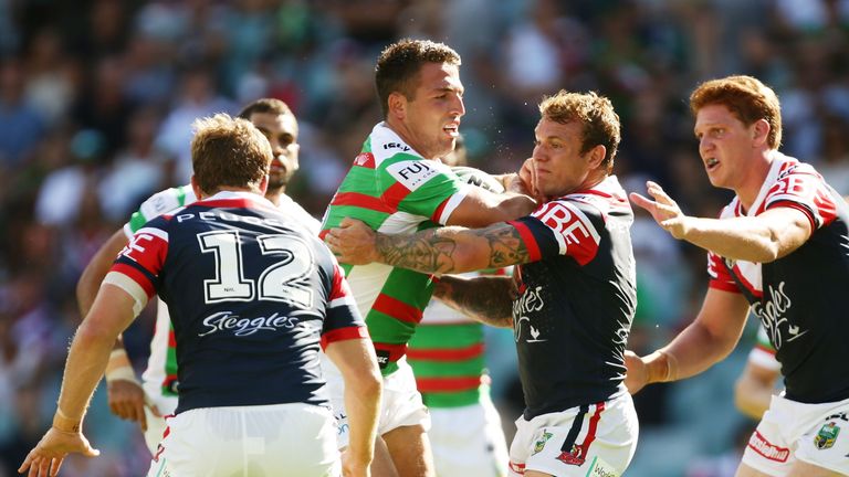 Sam Burgess of the Rabbitohs is tackled during the NRL match against the Roosters