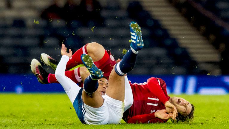 Scotland's Liam Bridcutt (left) challenges Erik Sviatchenko of Denmark.