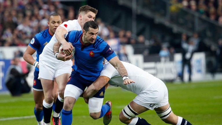 France's Scott Spedding is tackled by England's Owen Farrell (left) during the Six Nations match between France and England at the Stade de France 