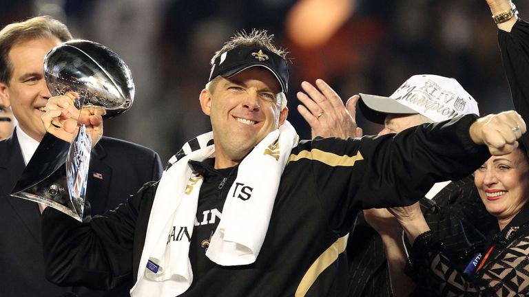 MIAMI GARDENS, FL - FEBRUARY 07: Head coach Sean Payton of the New Orleans Saints holds up the Vince Lombardi Trophy after defeating  the Indianapolis Colt