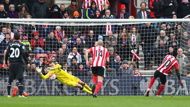 Simon Mignolet of Liverpool saves a penalty from Sadio Mane.