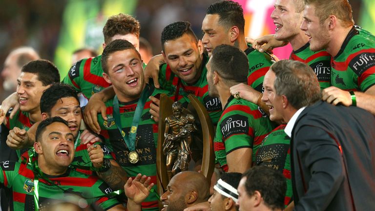 SYDNEY, AUSTRALIA - OCTOBER 05:  Souths players Sam Burgess and Ben Te'o celebrate with the Provan Summons trophy after their teams win at the 2014 NRL Gra