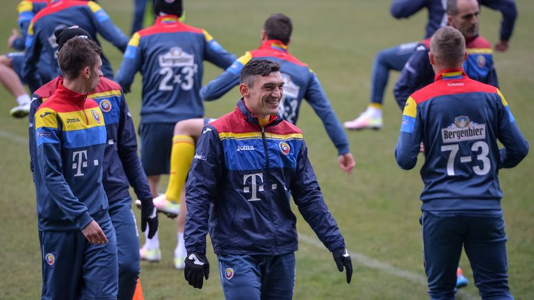 Romanian striker Claudiu Keseru laughs during a training session on March 26, 2016, on the eve of the friendly football match Romania against S