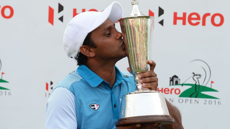 India's S.S.P Chawrasia poses with the trophy after winning the European Tour Indian Open golf tournament