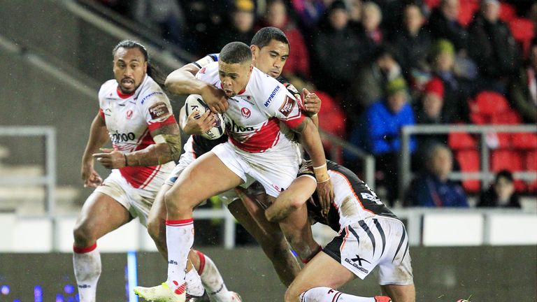 St Helens Jordan Turner tackled by Castleford's Junior Moors and Andy Lynch.