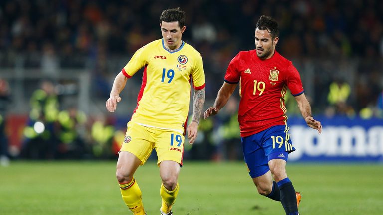 Bogdan Stancu of Romania battles for the ball with Mario Gaspar of Spain during the International Friendly match between 