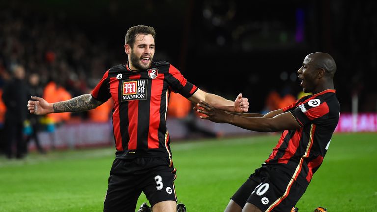 Bournemouth's Steve Cook (left) celebrates scoring his team's first goal against Southampton with team-mate Benik Afobe