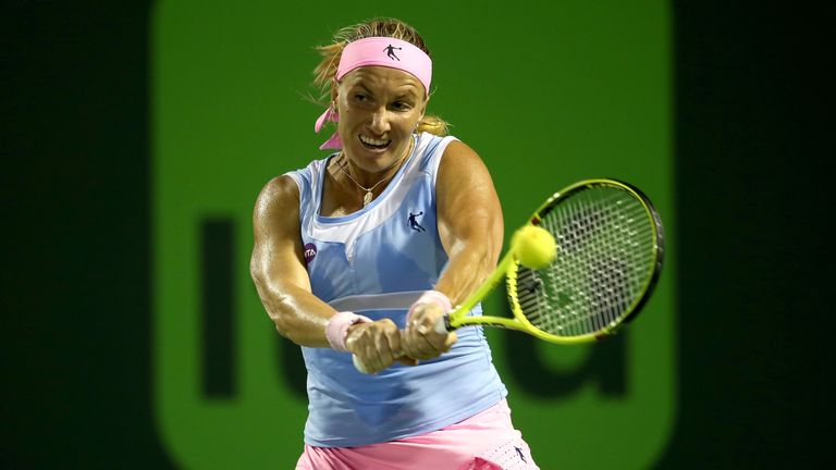Svetlana Kuznetsova returns a shot to Ekatarina Makarova  during their Miami Open quarter-final