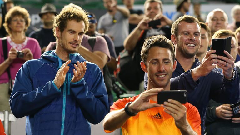 Andy Murray watches his brother Jamie Murray and Bruno Soares winning the Australian Open men's doubles title