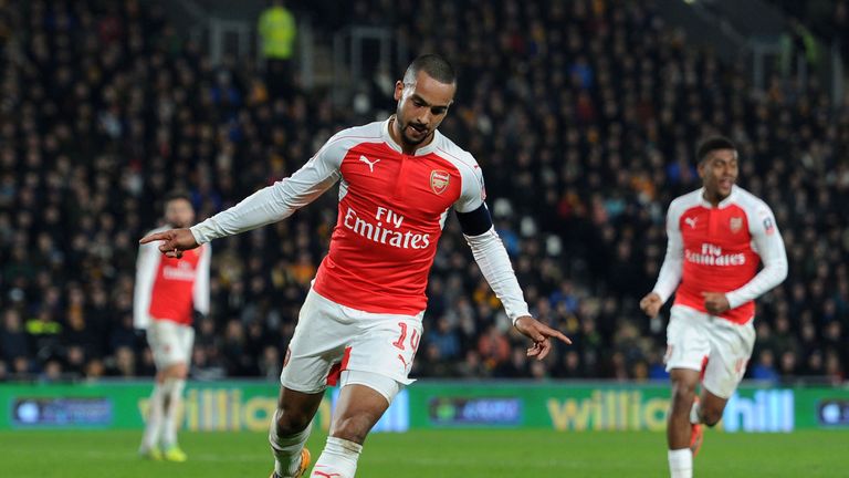 HULL, ENGLAND - MARCH 08:  Theo Walcott celebrates scoring Arsenal's 3rd goal during the match between Hull 