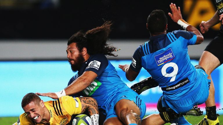 TJ Perenara of the Hurricanes dives over to score a try 