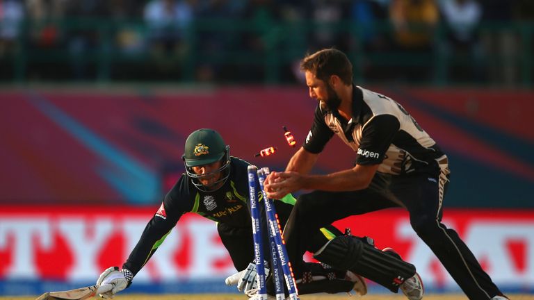 Usman Khawaja of Australia is run out by Grant Elliott of New Zealand during the ICC World Twenty20 India 2016 Super 10s clash